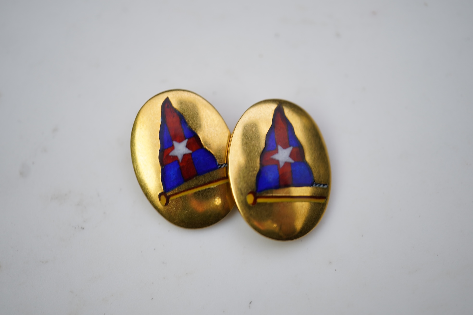 A pair of 9ct gold and enamel cufflinks, circa 1966